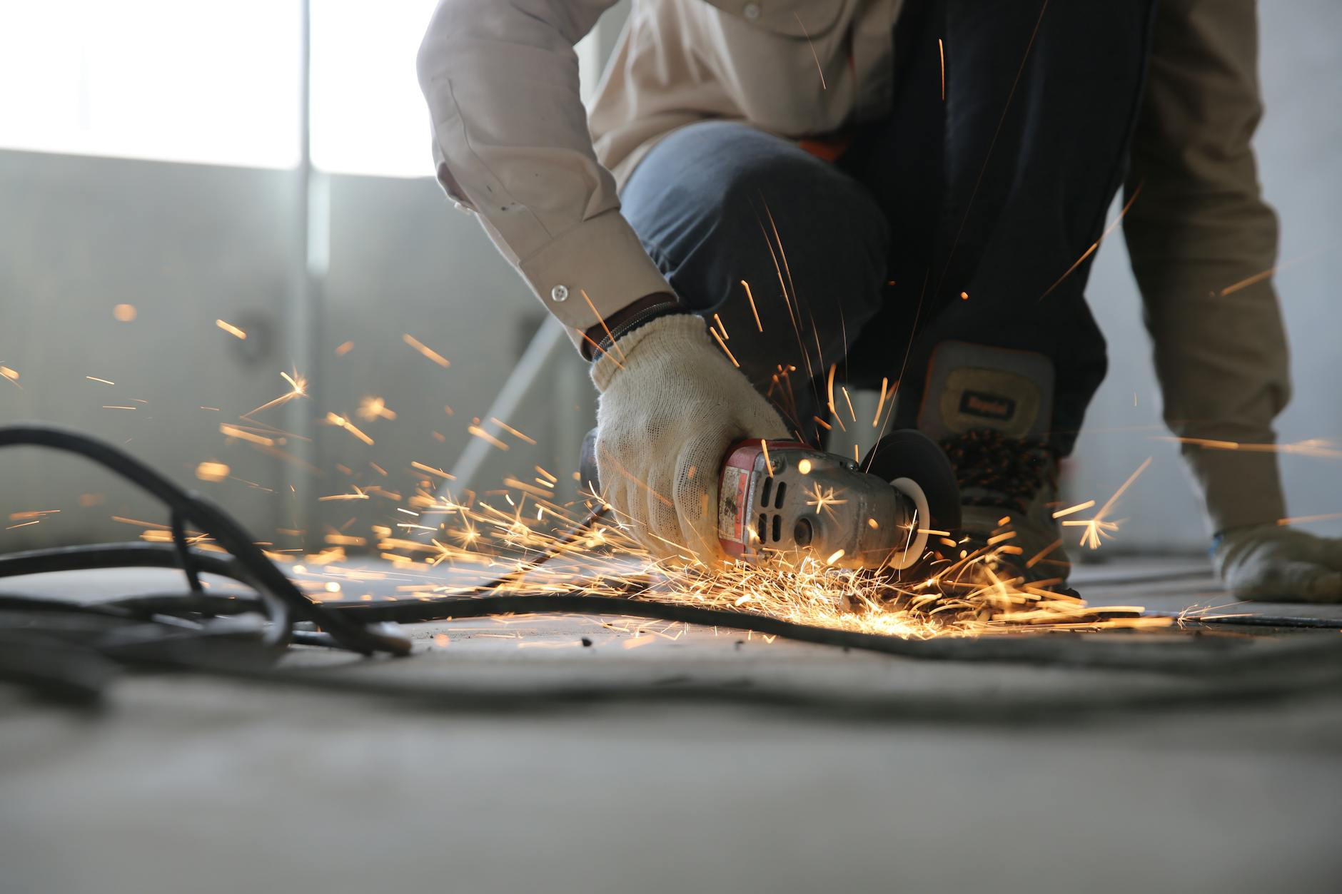 Engineers collaborating in a gear manufacturing workshop