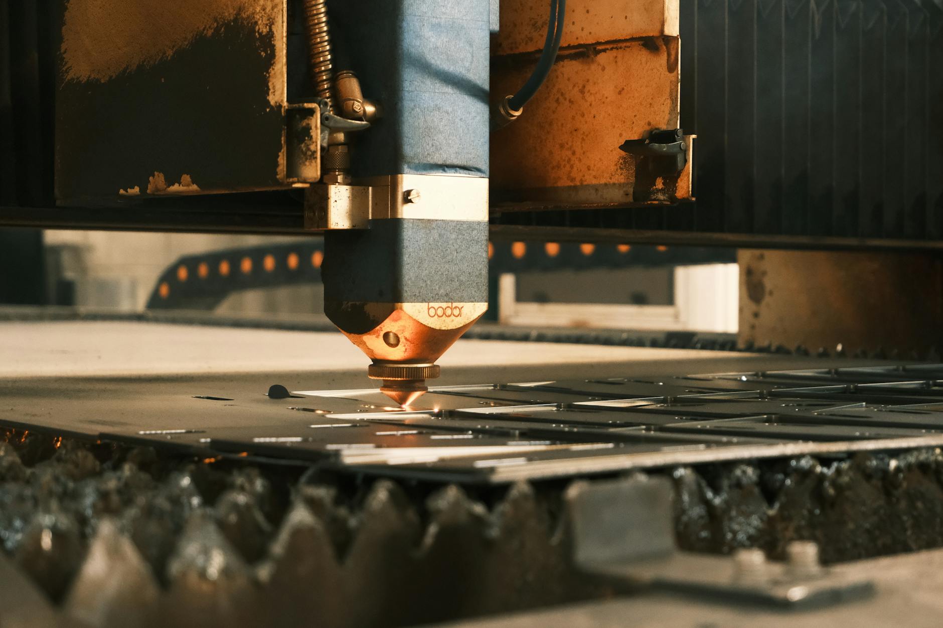 Technician operating precision machinery in a manufacturing plant